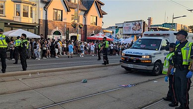 Police officers at the Street Festival after shooting in Toronto