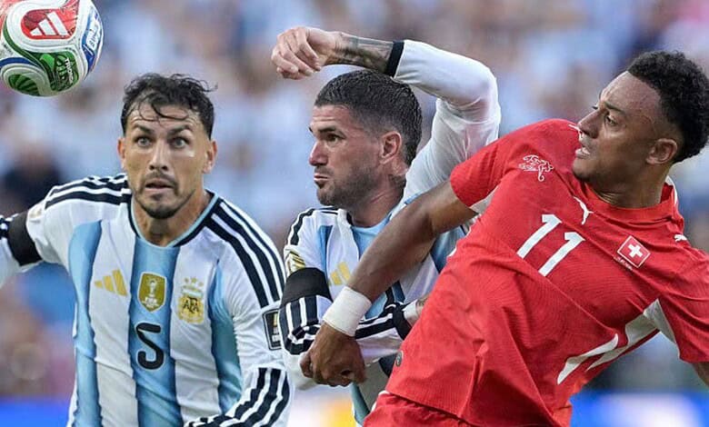 Argentina and Switzerland players jostle for the ball