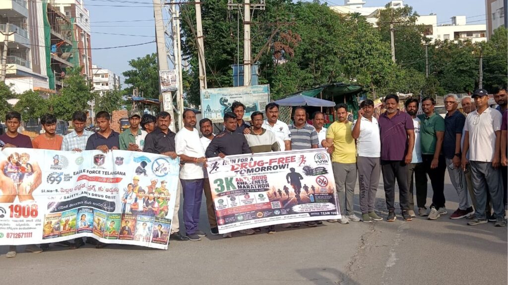 Group of people protesting for a 3K march against MG-Free Telangana, holding banners and placards.