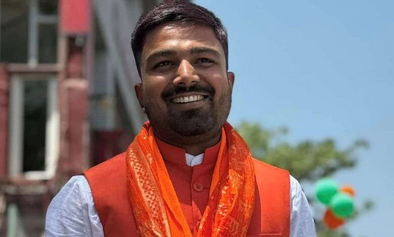 Manish Kashyap smiling in traditional attire during a public event.