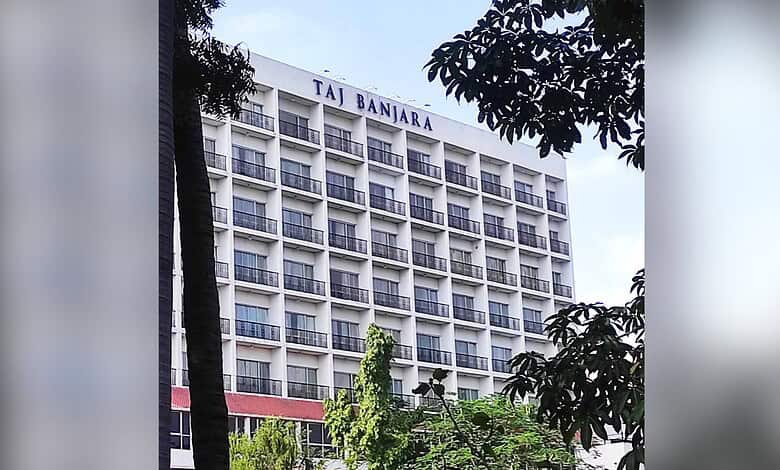 Taj Banjara hotel building in Hyderabad with multiple balconies and trees in foreground.