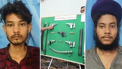Two young men with illegal arms seized by Bidar police, displayed on a green board.