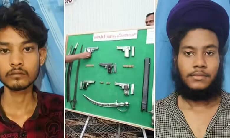 Two young men with illegal arms seized by Bidar police, displayed on a green board.