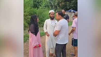 Group of people engaged in a serious outdoor discussion in Uttarakhand.