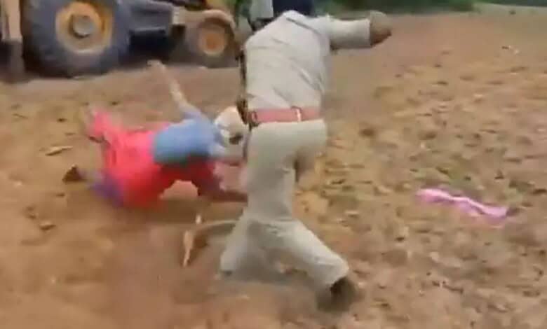 Forest official attacking tribal woman in Bhadradri Kothagudem, India.