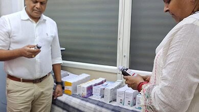 Officials inspecting seized illegal medicines displayed on a table in Chandrayangutta.