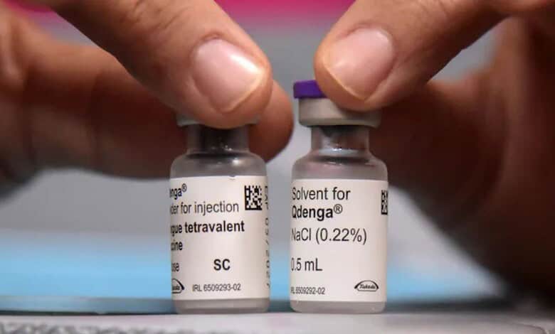 Vials of Takeda's Dengue Vaccine QDENGA with hands handling them.