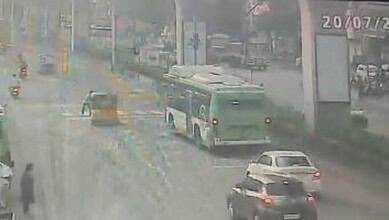 Bus and cars involved in a traffic incident on a rainy day in Kukatpally.