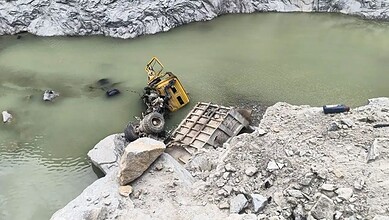 Lorry submerged in quarry water after accident in Tumakuru, India.