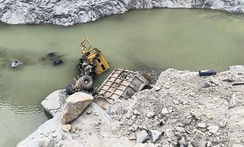 Lorry submerged in quarry water after accident in Tumakuru, India.