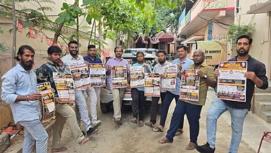 Group of men holding newspapers outdoors in Telangana for a gig event.