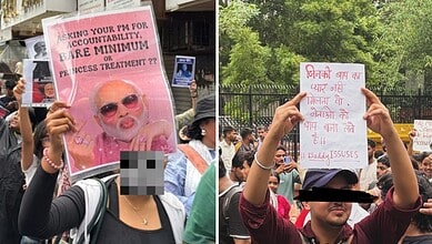 Protesters holding signs during a demonstration, one with a pink image of a woman and another with Hindi/.
