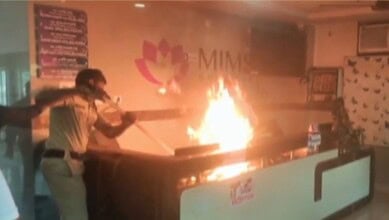 Hospital reception set ablaze with flames and smoke during a protest in Telangana.