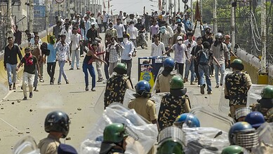 Protesters clash with police during bandh in Bihar over NEET paper leak, police firing reported.