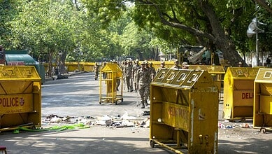 Police barricades and personnel at the scene during a protest at Jantar Mantar.