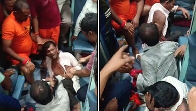 Three men beaten on a moving train, surrounded by onlookers, in a tense scene.