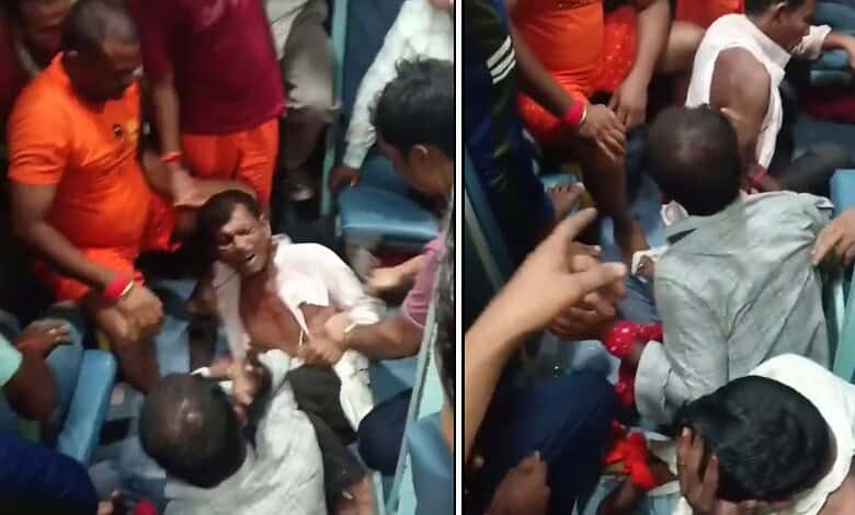 Three men beaten on a moving train, surrounded by onlookers, in a tense scene.