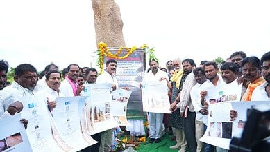 Group of people unveiling a plaque at Mudumal Niluvurallu Park development event in Telangana.