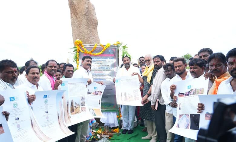 Group of people unveiling a plaque at Mudumal Niluvurallu Park development event in Telangana.