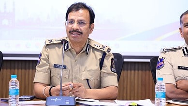 Hyderabad police official speaking at a safety meeting with fire safety measures discussed.