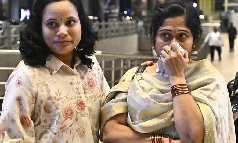 Two women wait for a Passenger to return from Vietnam