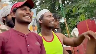 Hindu-Muslim friends smiling and spreading harmony during a cultural event.
