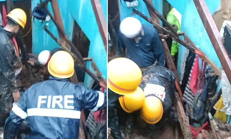 Rescue operation at a collapsed house in Mangaluru after heavy rain, with firefighters and rescue workers.