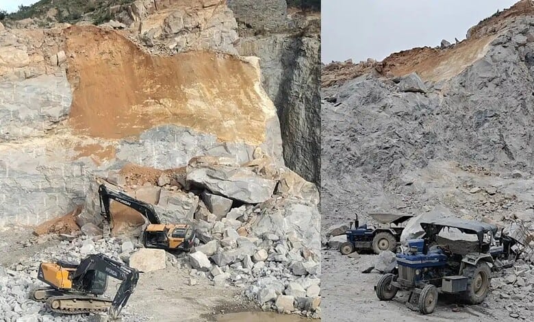 Construction site with excavators and trucks near a rocky quarry.