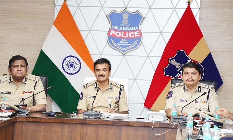 Telangana DGP Anand reviews policing with senior officers in a conference room.