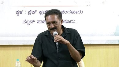 Prakash Raj speaking into a microphone during a court appearance in Bengaluru.