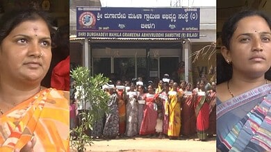 Women gather outside a government office in Bagalkot, Karnataka, protesting a fraud case.