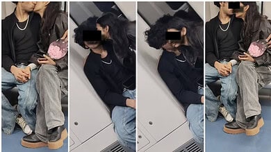 Couple sitting closely inside Bengaluru Metro, engaging in PDA, with faces obscured.