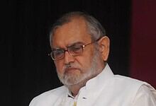 Zafarul-Islam Khan with a serious expression at the award ceremony.