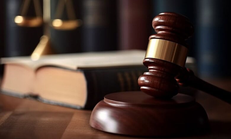 Gavel and law books symbolising justice and legal proceedings.