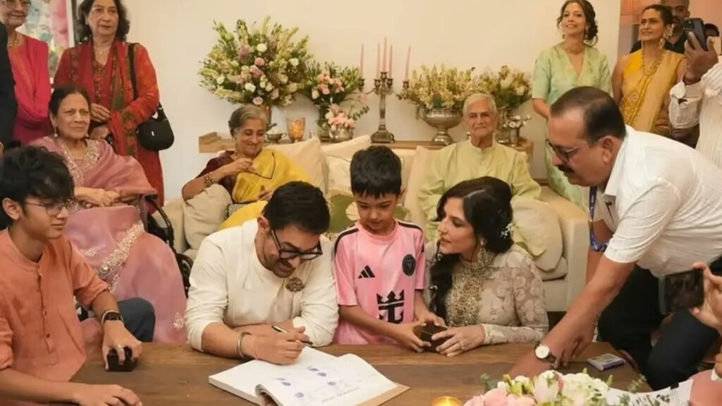 Aamir Khan's family and friends gather around him during his wedding celebration with Gauri Spratt.
