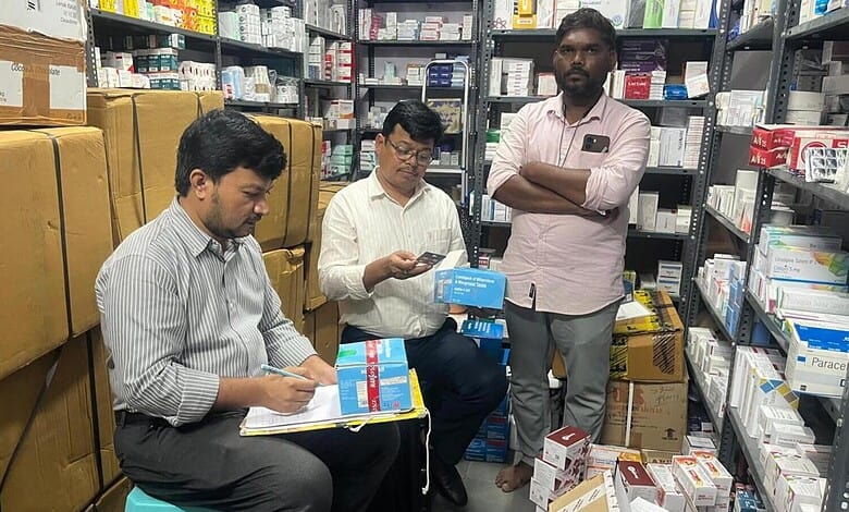 Three men inspecting medical supplies in a pharmacy storage room.