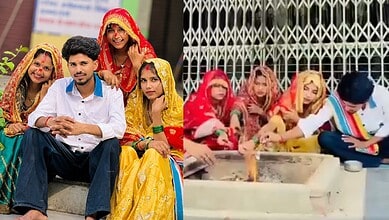 Group of people in traditional Indian wedding attire participating in a wedding ritual.