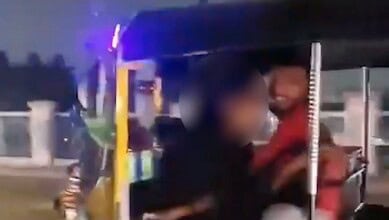 Juvenile auto driver with woman in Chaderghat