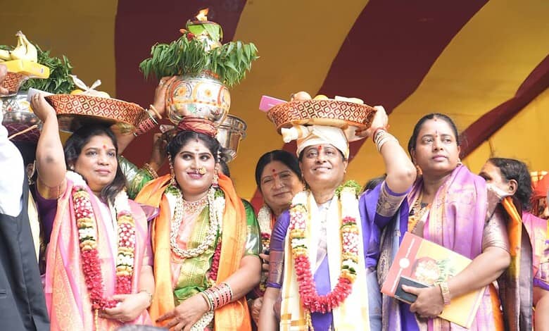 Women participating in Golconda Bonalu 2026 with traditional attire and decorated pots on their heads.