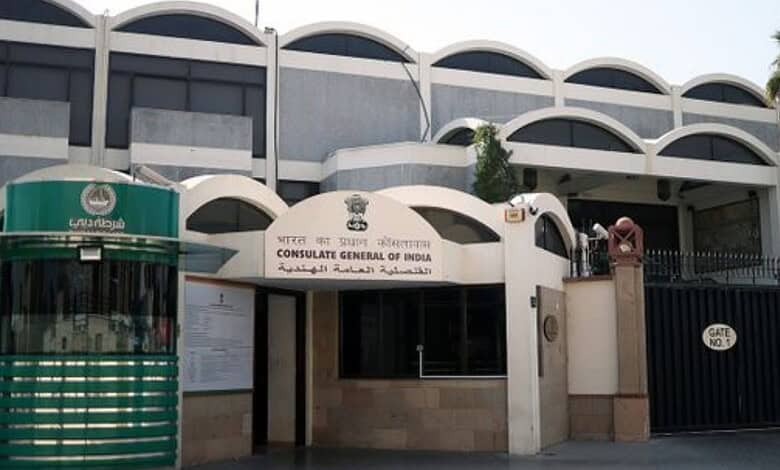 Indian Consulate Dubai building with signage and security gate for NRI certificate services.