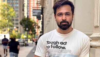 Emraan Hashmi filming in Hyderabad's Moinabad, wearing a white T-shirt with text.