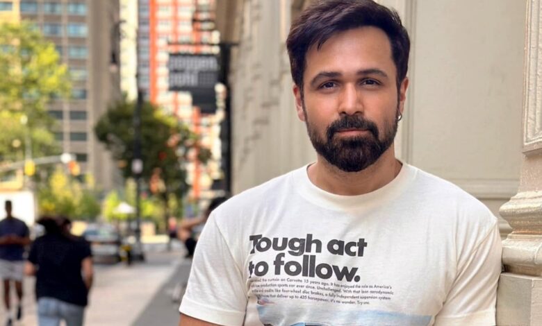 Emraan Hashmi filming in Hyderabad's Moinabad, wearing a white T-shirt with text.