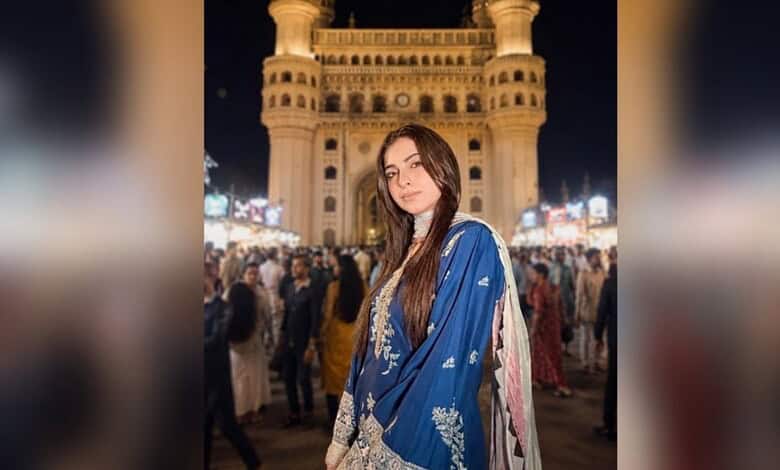 Farrhana Bhatt in a blue traditional dress at Charminar during night time.