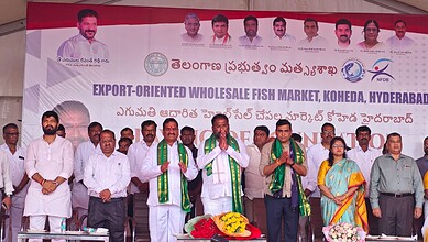 Group of officials and vendors at Hyderabad fish market inauguration event.