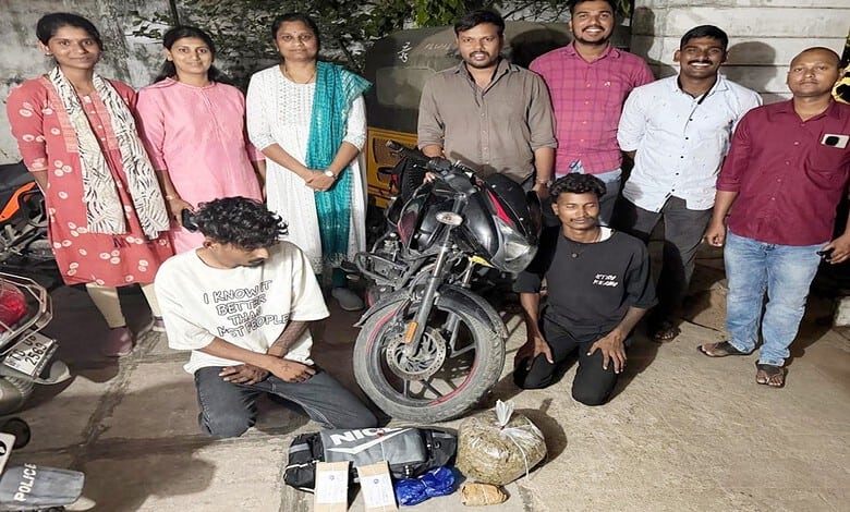 Group of people with seized ganja and motorcycle in Hyderabad, India.