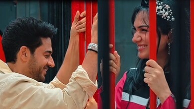 Gaurav Khanna and Akanksha smiling at each other behind red bars.