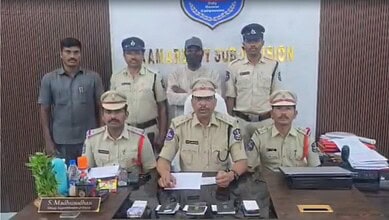 Police officers and officials at a press conference about Russia job scam in Kamareddy.