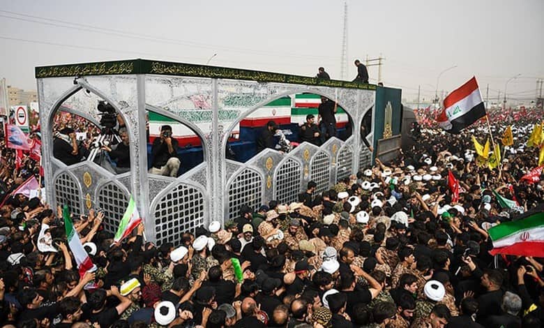 Large crowd of mourners gathered in Qom with flags and banners for Khamenei's farewell ceremony.