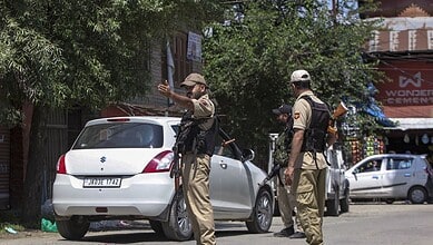 Security personnel keep a vigil during an inspection of vehicles to maintain public safety following the recent terror attack in Anantnag, at Qaimoh, Kulgam district, Jammu and Kashmir, Monday, July 27, 2026. (PTI Photo)