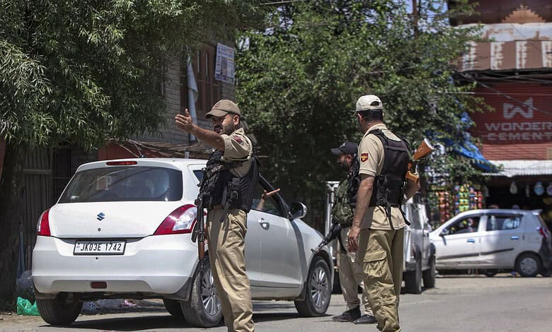 Security personnel keep a vigil during an inspection of vehicles to maintain public safety following the recent terror attack in Anantnag, at Qaimoh, Kulgam district, Jammu and Kashmir, Monday, July 27, 2026. (PTI Photo)